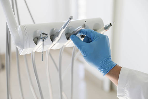 Professional Tooth Extraction technician working in Kansas, KS